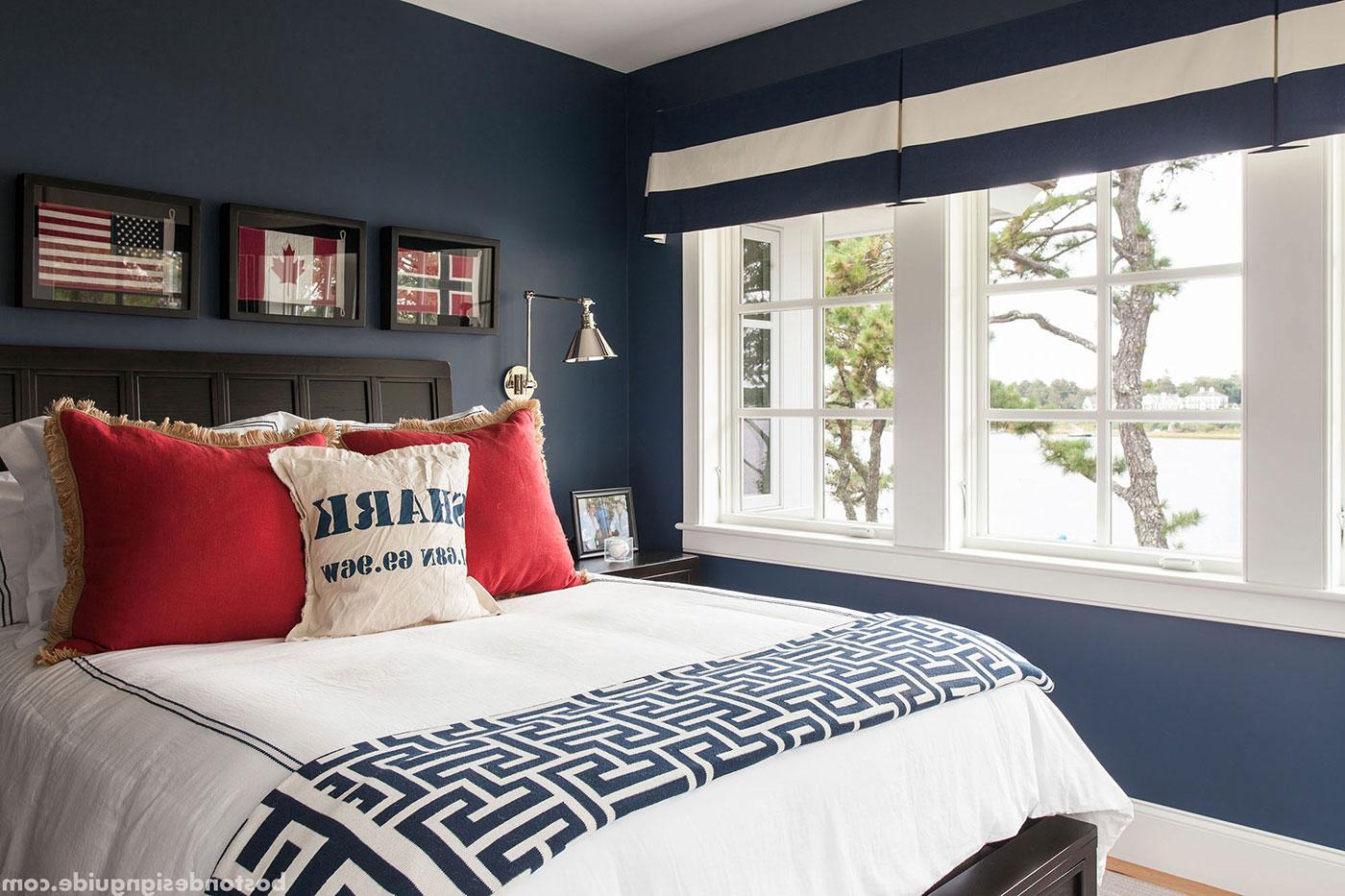 Red, white and blue bedroom by high-end builder Rick Roy Construction